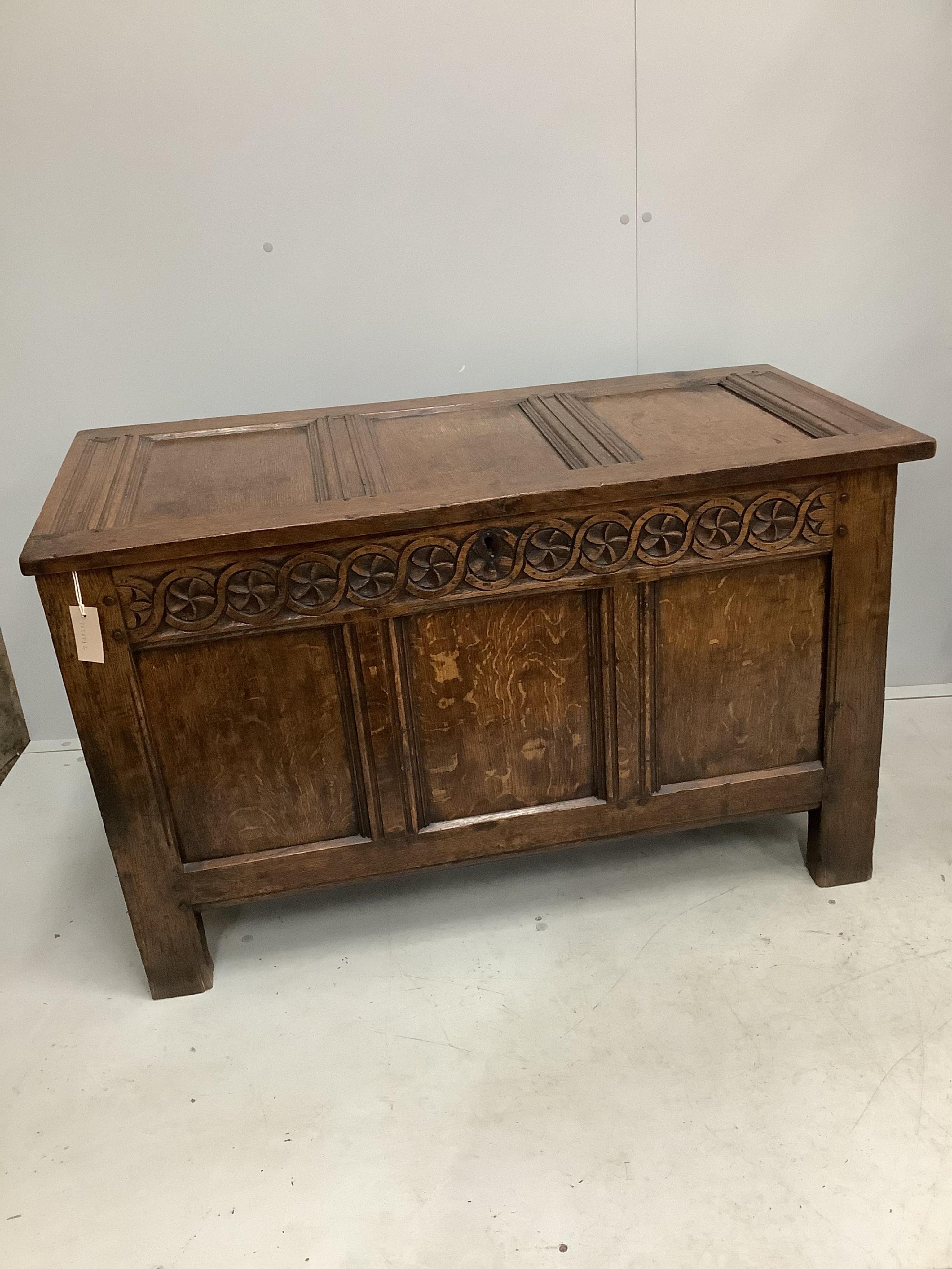 A 17th century oak coffer, width 112cm, height 68cm. Condition - fair to good